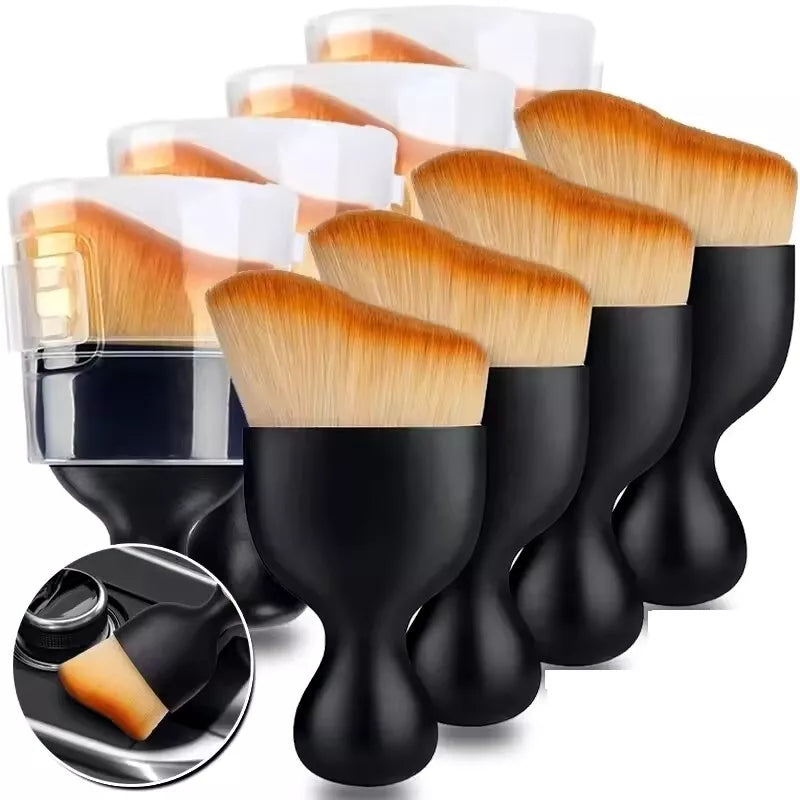 A set of black and gold auto interior detail brushes with soft synthetic bristles, displayed against a white background.