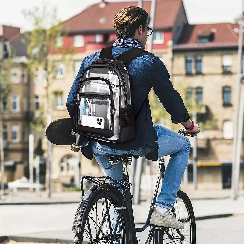 Man riding bicycle wearing large clear PVC backpack