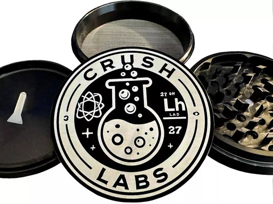 Aluminum 4-piece herb grinder with 'Crush Labs' logo on a white background