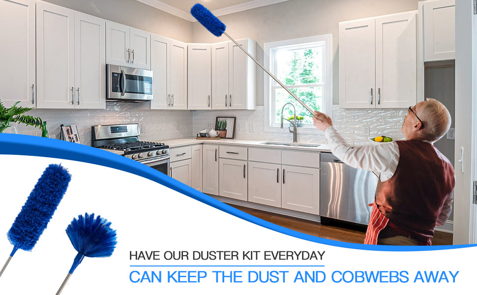 A man in a kitchen uses a long-handled blue microfiber ceiling fan duster to clean the air near a window. The image includes two blue dusters in the lower left corner and text that reads 'HAVE OUR DUSTER KIT EVERYDAY CAN KEEP THE DUST AND COBWEBS AWAY.
