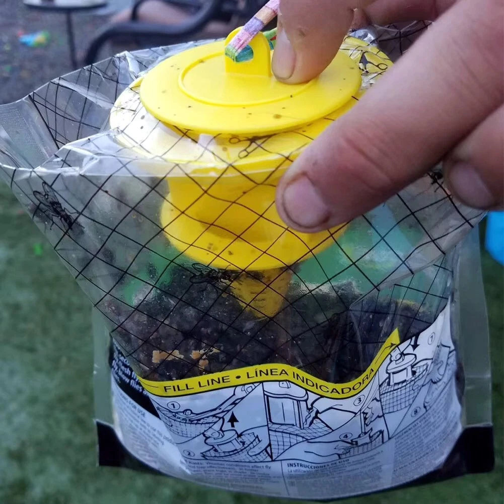 Hand opening a fly trap bag full of dead flies.