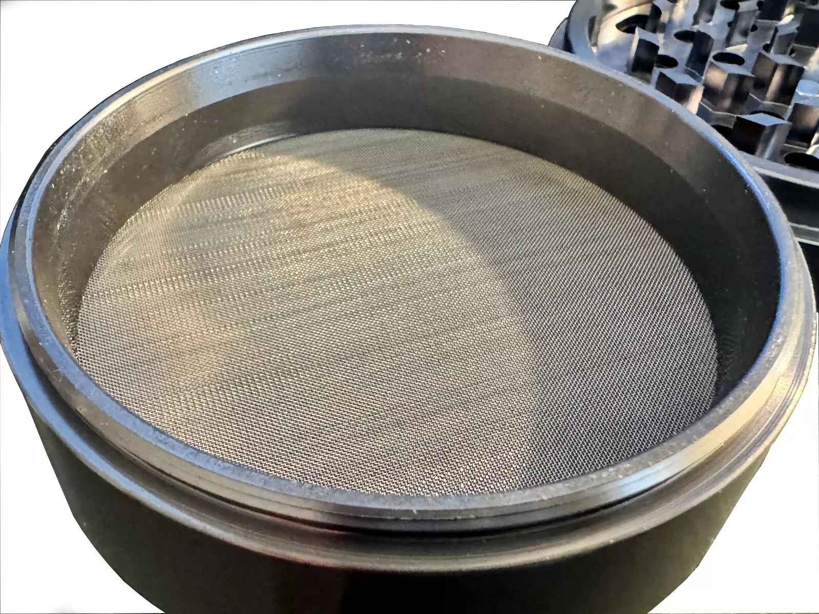 Fine mesh screen in Crush Labs 4 piece aluminum herb & spice grinder