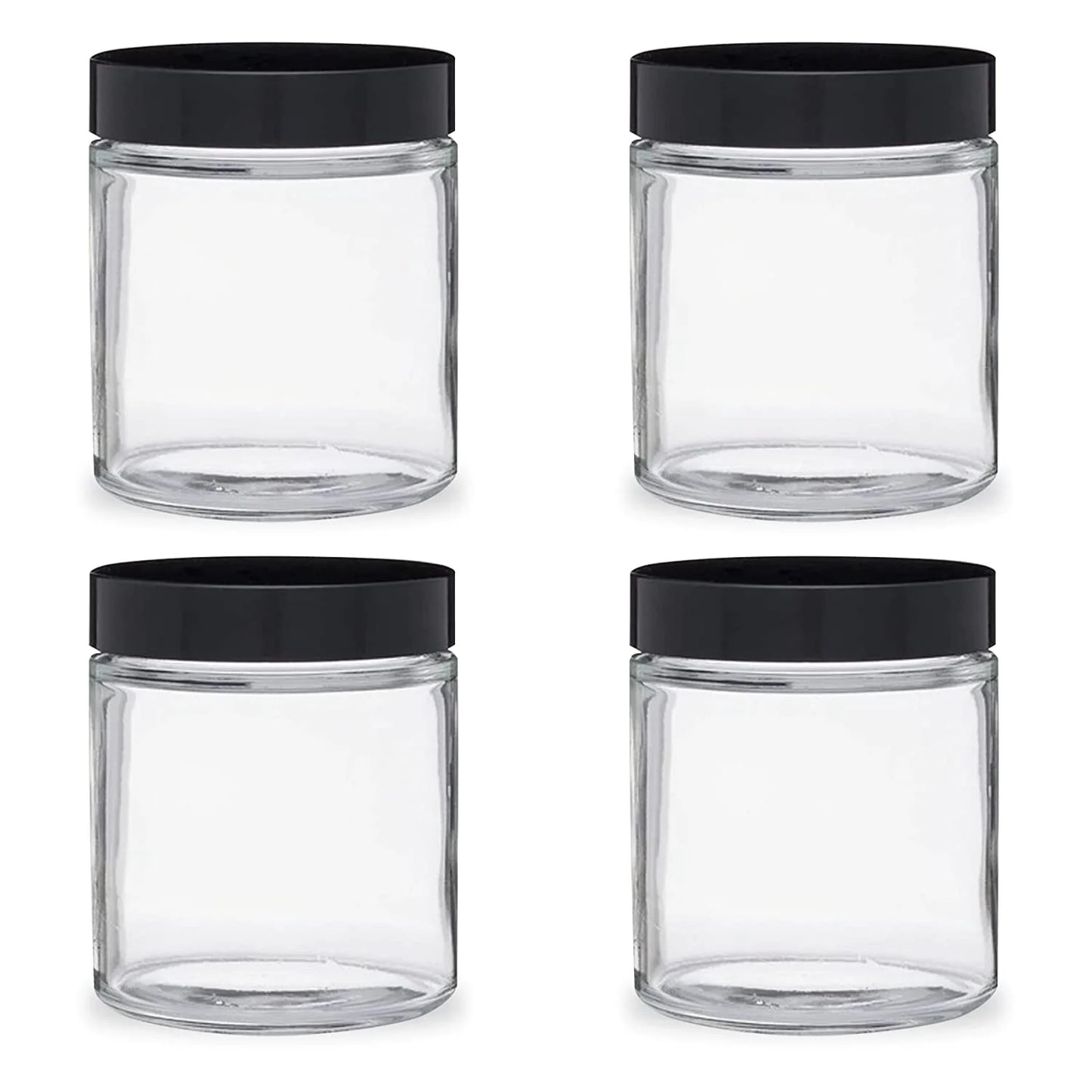 Four clear glass jars with black lids on a white background