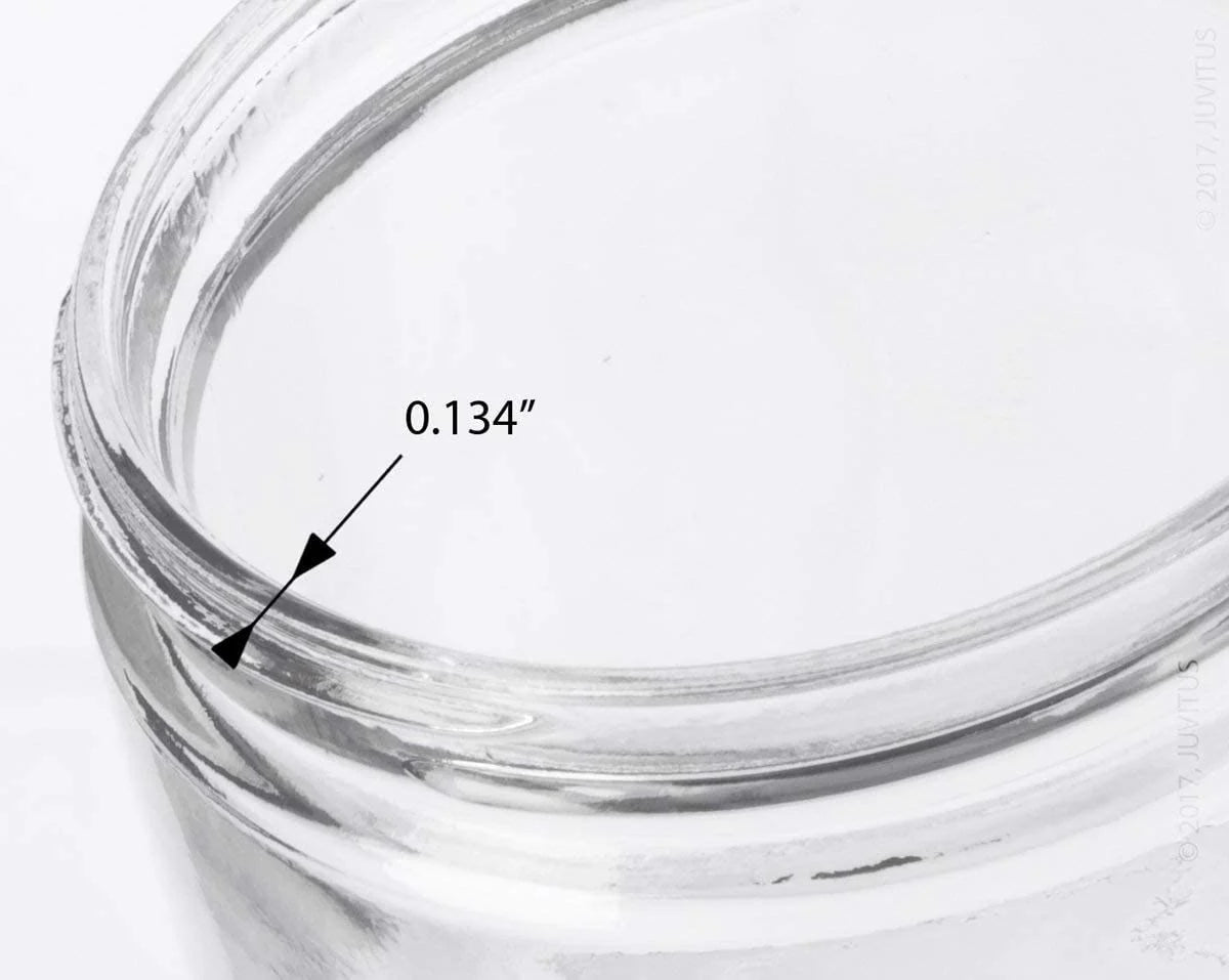 Close-up of a glass container with a measurement label indicating 0.134 inches.