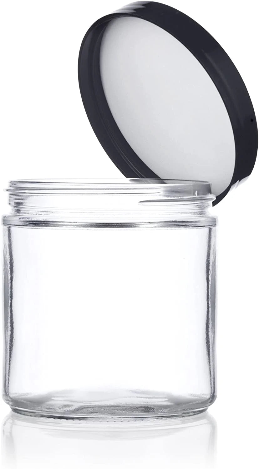 Clear glass jar with a black lid on a white background