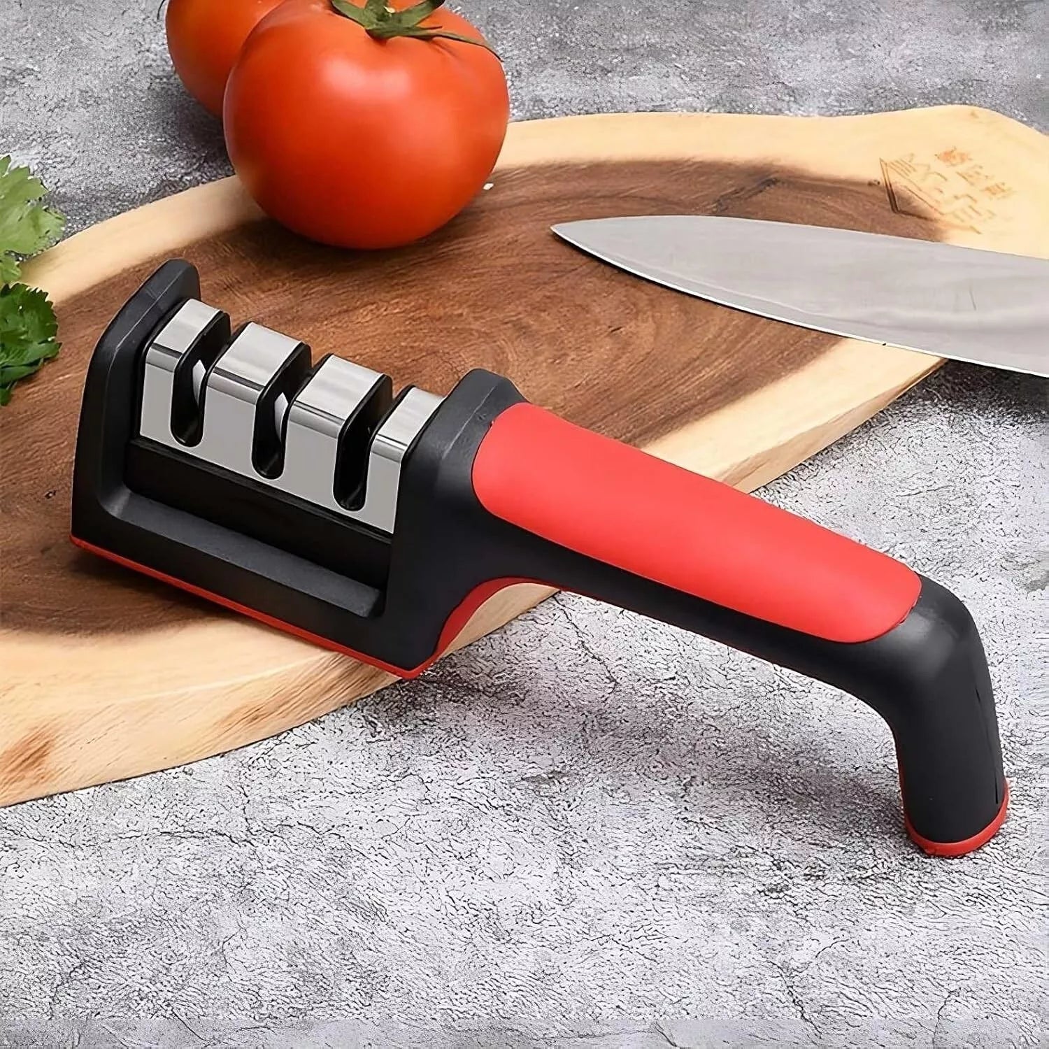3 stage knife sharpener on cutting board with tomato