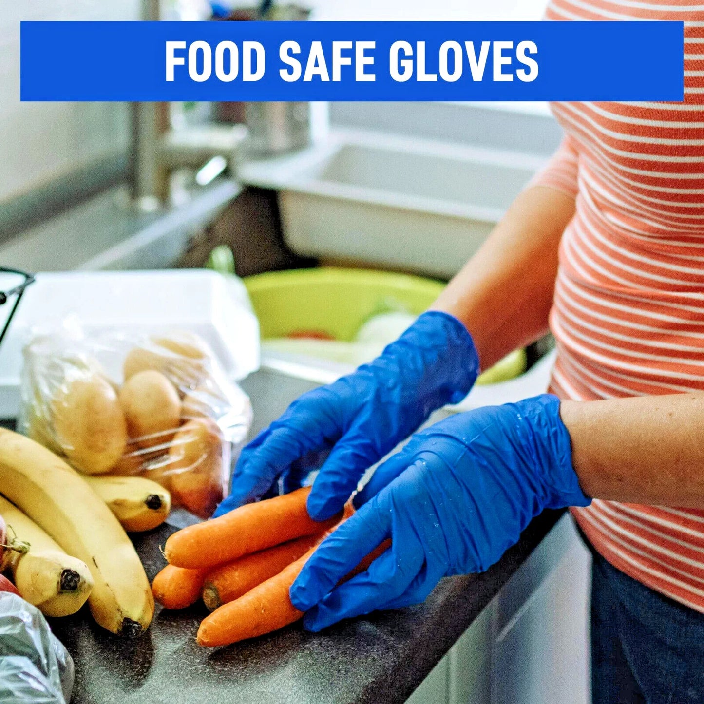 Person wearing blue nitrile food safe gloves handling carrots in a kitchen.