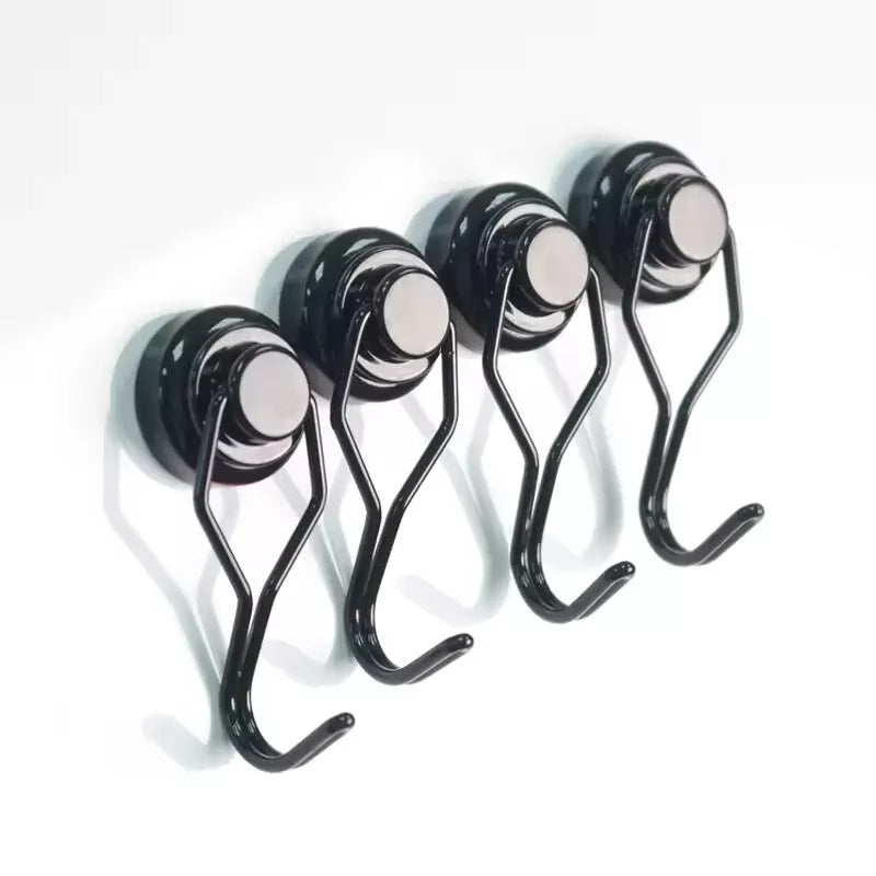 Set of black hooks with metallic eyes on a white background