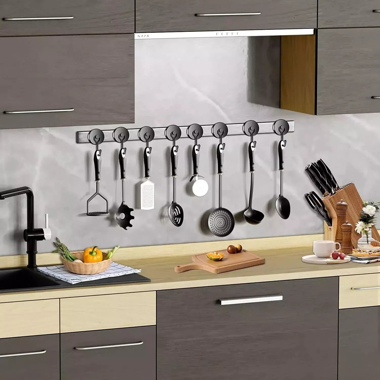 Modern kitchen with utensils hanging on a magnetic strip