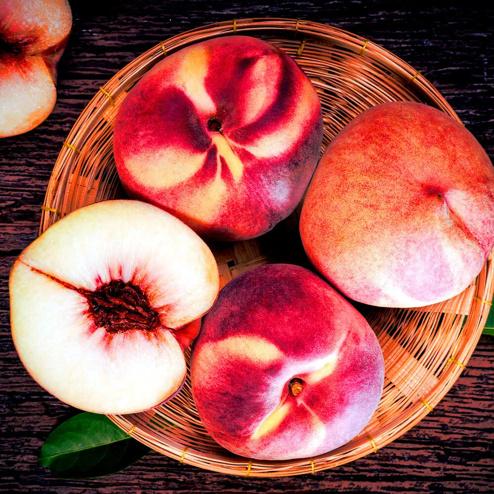 Peaches in a woven basket on a wooden surface