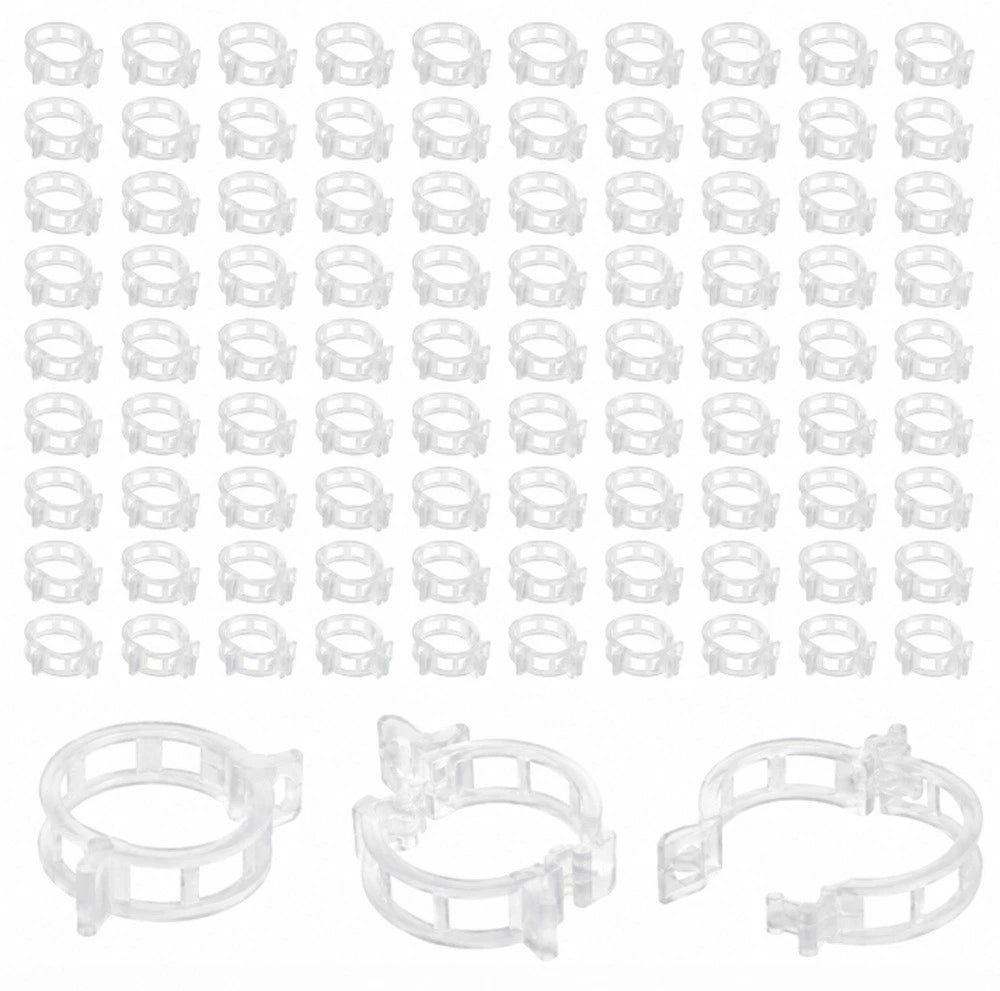 Multiple white plant clips arranged in rows on a white background