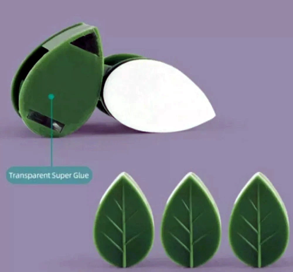 Green leaf-shaped plant wall clips with a container labeled 'Transparent Super Glue' on a purple background