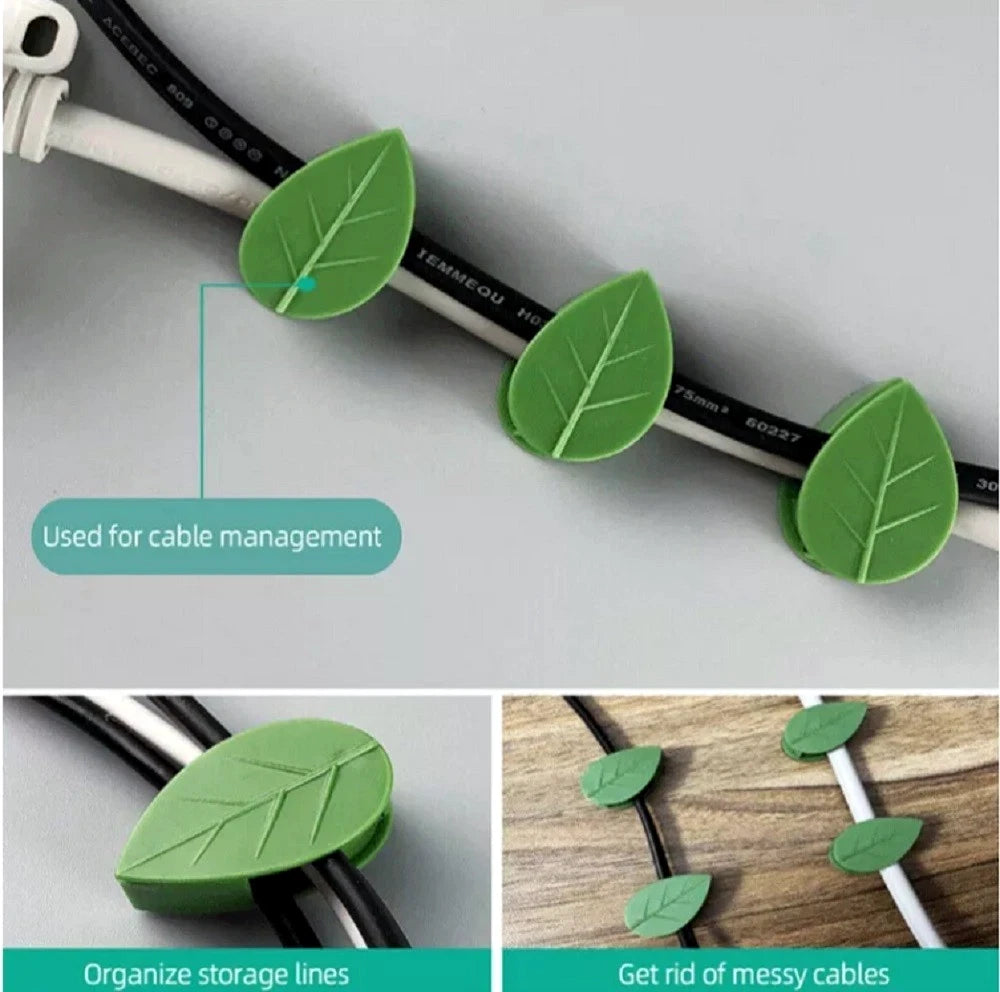 Leaf-shaped cable management plant wall clips used to organize cables on a gray surface.