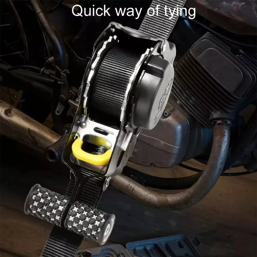 Motorcycle tie-down strap with quick-release mechanism on a vehicle.