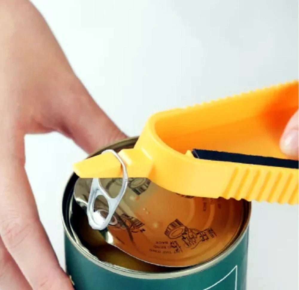 Person using a yellow can opener to open a can on a white background