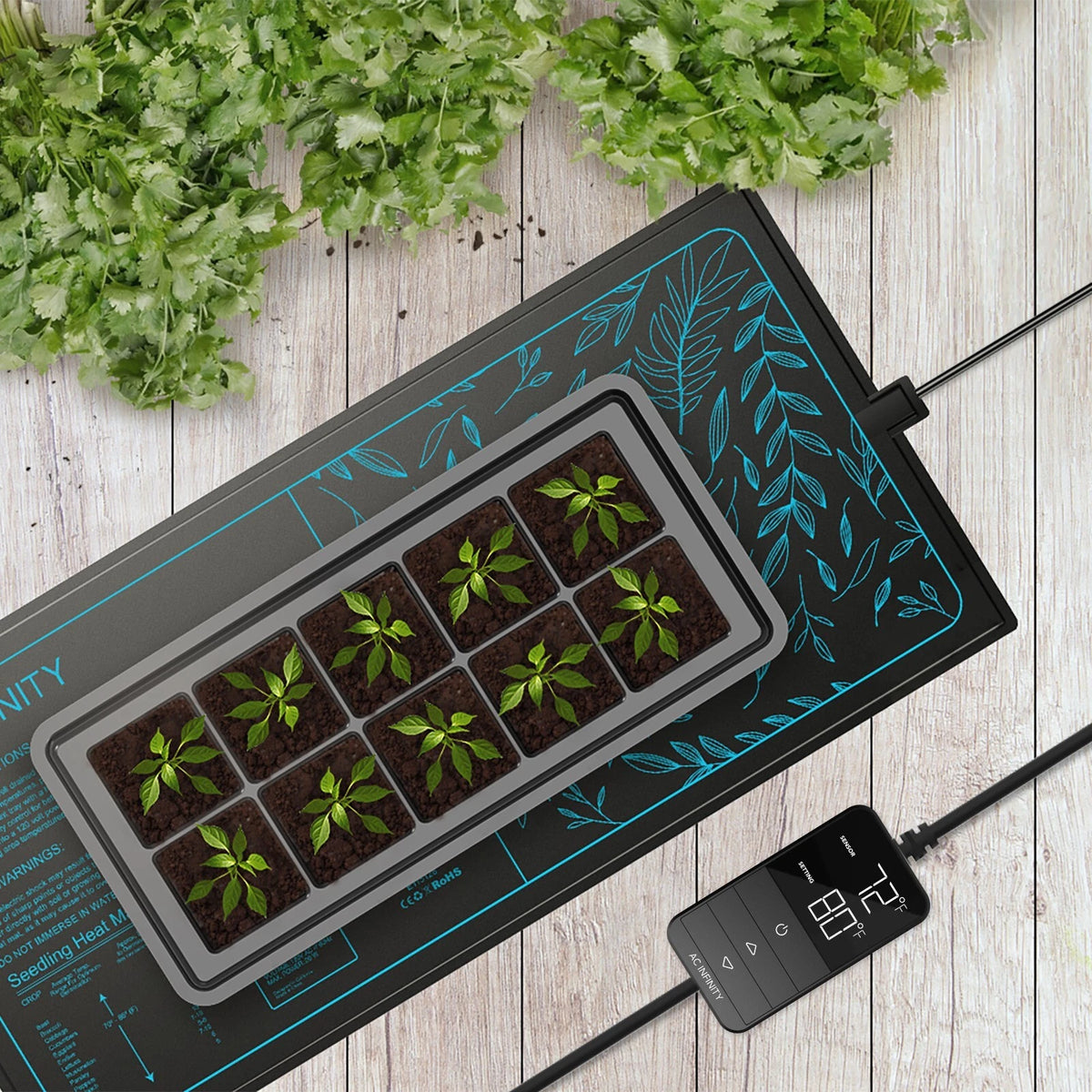 Plants in seedling tray on Suncore seedling heat mat with digital thermostat with wood background.