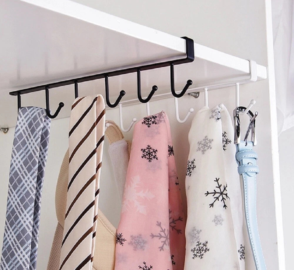 Clothing accessories hanging on an under-the-shelf rack with hooks