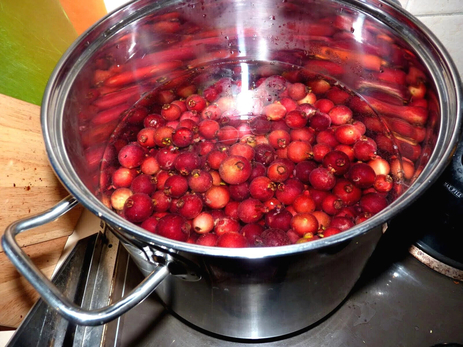 Red Strawberry Guava fruits in a pot of water. (Psidium cattleianum)
