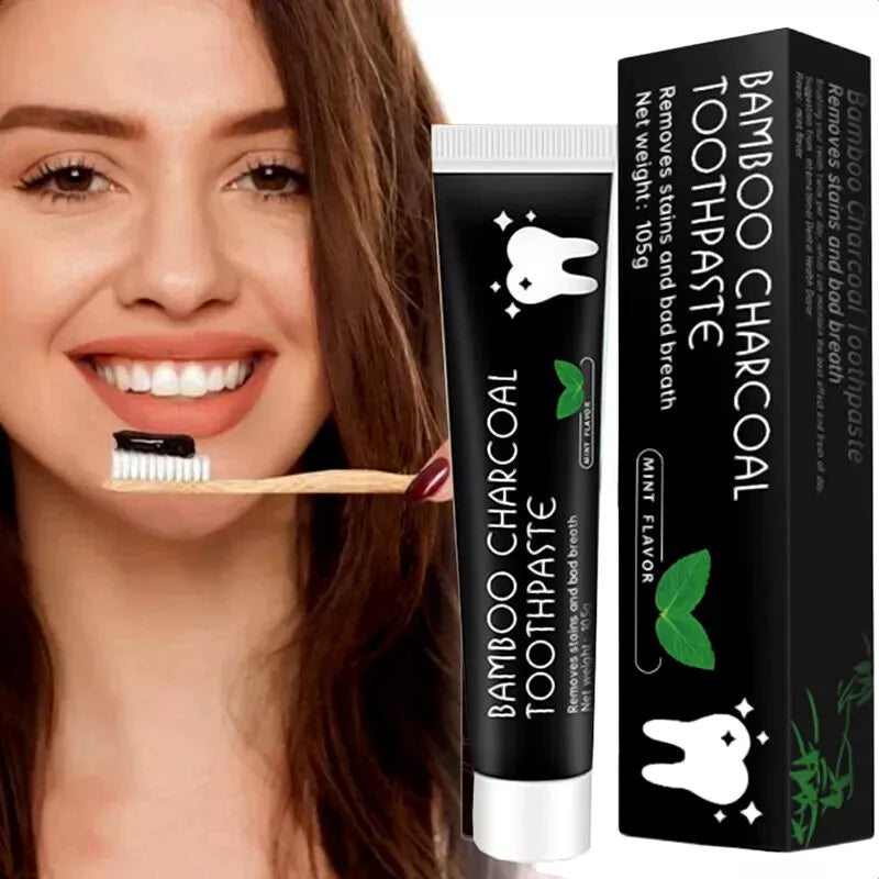 woman using fluoride free bamboo charcoal toothpaste