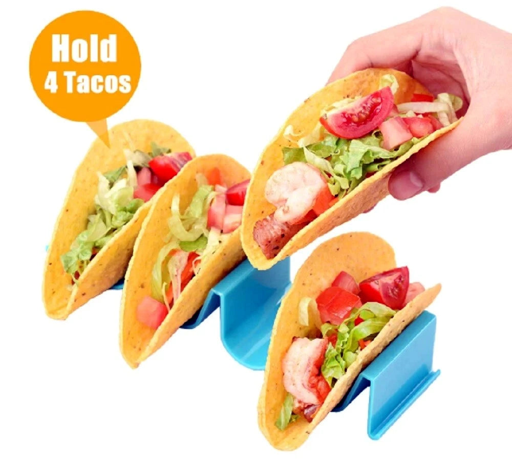Taco holder with four tacos filled with ingredients, held by a hand.
