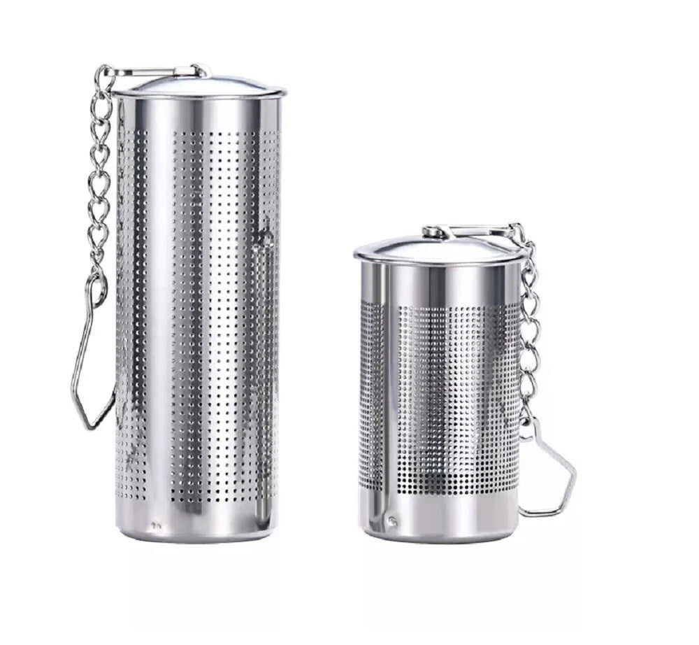 Two stainless steel tea infusers with chains on a white background