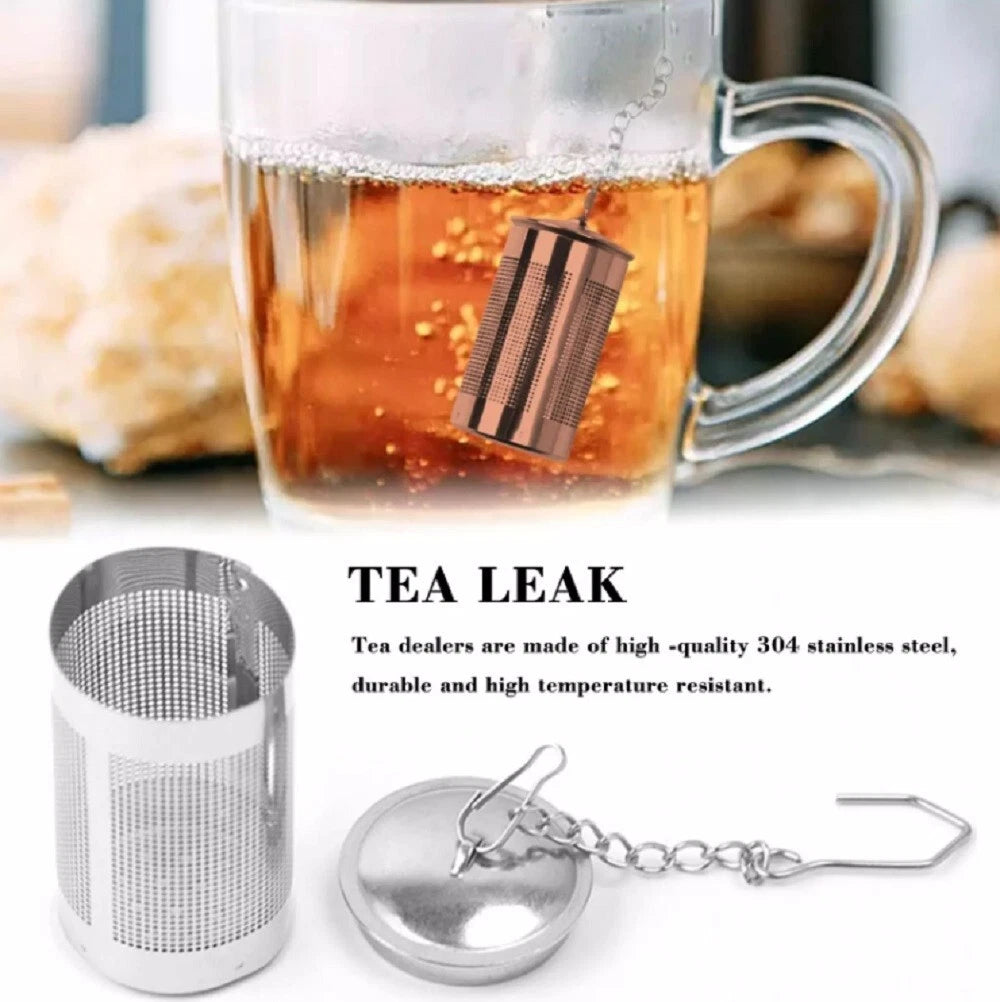 Stainless Steel Tea infuser with a glass mug of tea in the background