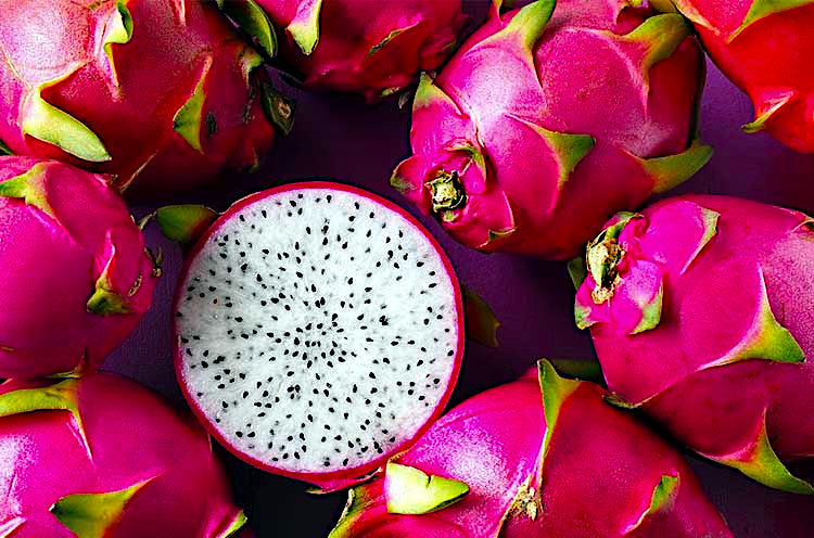 Red and yellow skin white dragon fruits with white flesh and black seeds. (Hylocereus undatus)